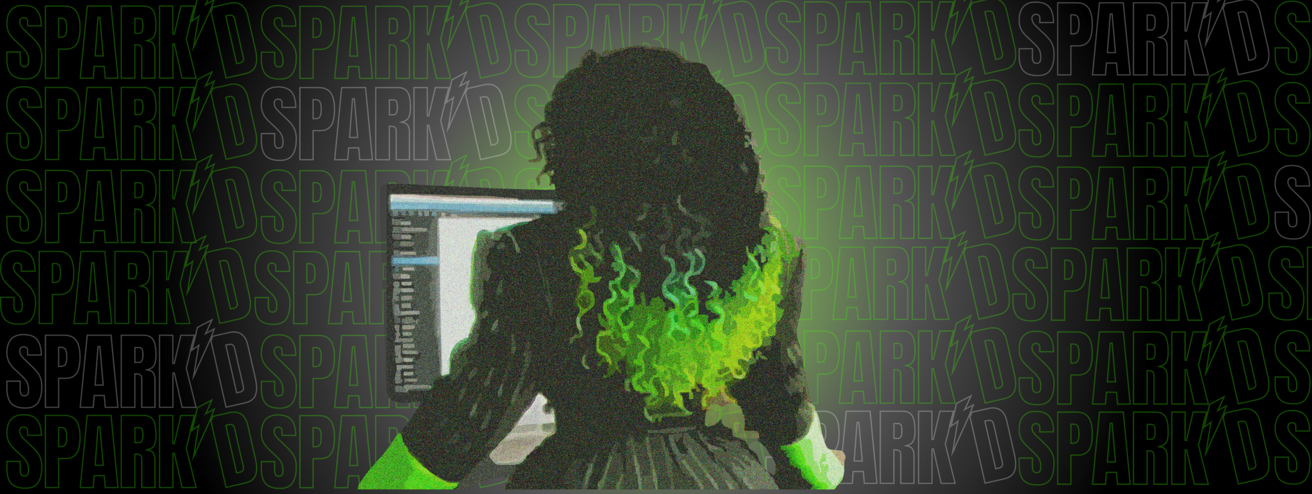 Image of the back of Yelley working on the computer embodying SPARK'D By Yelley's blend of fun and professionalism.
